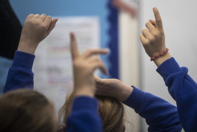 <p>A teacher who was injured after a pupil threw a laptop at her was awarded a five-figure settlement, union figures show</p>