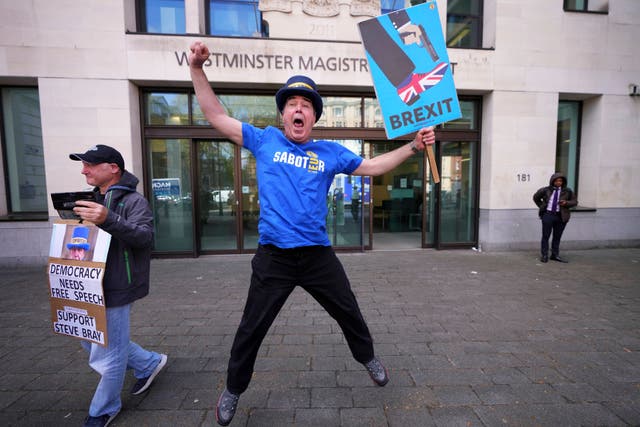 <p>Steve Bray celebrates outside Westminster Magistrates’ Court</p>
