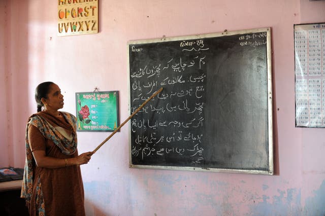 <p>File. Teacher gives lessons in Urdu language</p>