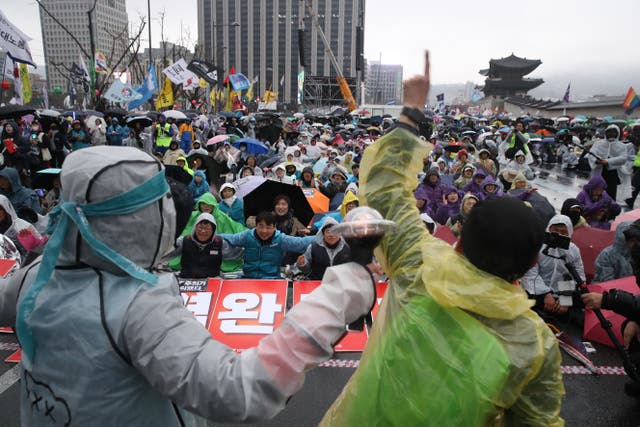 <p>Protesters opposed to impeached South Korean president Yoon Suk Yeol participate in a rally to celebrate the expulsion of the impeached President </p>