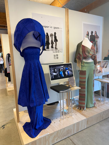 NZ fashion student presenting final graduate collection with detailed garment construction.