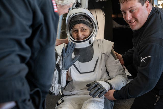 <p>Nasa astronaut Suni Williams being helped out of a SpaceX Dragon spacecraft after landing in the water off the coast of Tallahassee, Florida, on 18 March, 2025</p>